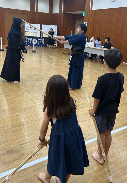 Children participating in the kendo experience