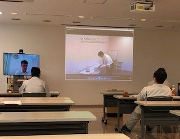 Participants attend a remote education session at Hitachi Works